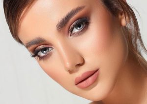getting the final touches from a bridal makeup artist in dubai
